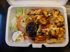Chicken kebab over rice