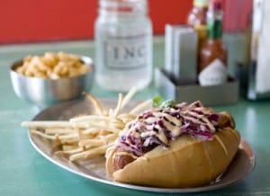 Sonoran hot dog (bacon-wrapped with black beans, cucumber cole slaw, queso and lime mayo)