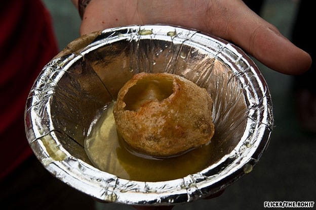 Paani puri are crisp, spicy water bombs, eaten in a single bite and gulp. 