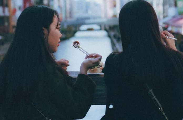 eating sushi with chopsticks