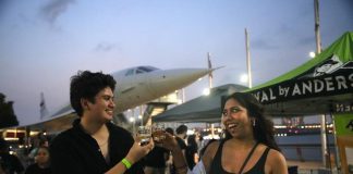 Bites, Brews & Battleships: The Summer Tasting Fest at the Intrepid Museum in NYC couple at fest at the Interpid Museum