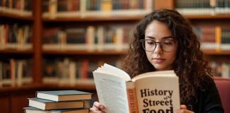 Library Tours: A Foodie’s Guide to Culinary Knowledge woman at new york public library reading about history of street food