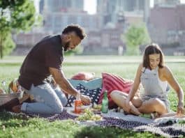 a man and woman planning a picnic