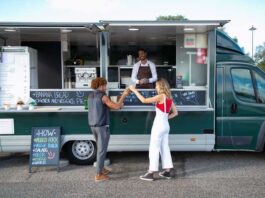 Event Catering Prospecting Checklist For Food Trucks Food truck owner reviewing an event catering prospecting checklist before contacting potential clients