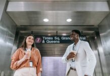 Why New Yorkers Take Their Coffee Seriously, Even at Work New Yorker holding a coffee cup while walking through the city