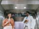 Why New Yorkers Take Their Coffee Seriously, Even at Work New Yorker holding a coffee cup while walking through the city